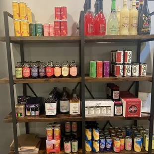 a shelf full of condiments and condiments