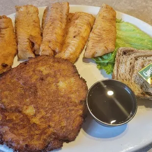 Three piece haddock fish fry with two extra pieces and a potato pancake