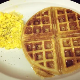 Belgian waffle with two eggs scrambled. Yummy!