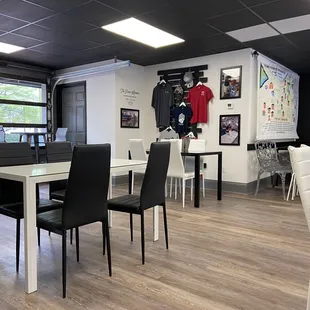 a dining area with tables and chairs