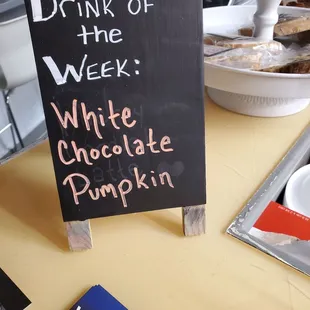 a sign that reads drink of the week white chocolate pumpkin