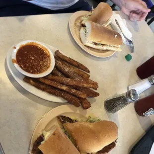 Meatball poboy, fried eggplant appetizer, hot sausage poboy.
