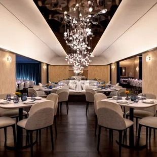 a dining room with a large chandelier