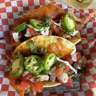 Chicken tacos with fresh toppings.