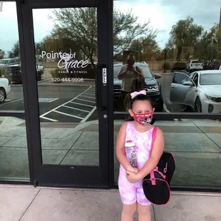 Daughter getting ready to go in for dance class.