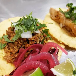 two tacos with meat and onions