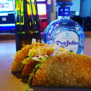 a taco and a bottle of tequila