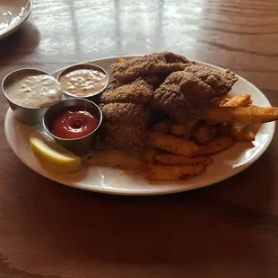 Louisiana Catfish with Seasoned Fries with Rumole sauce.