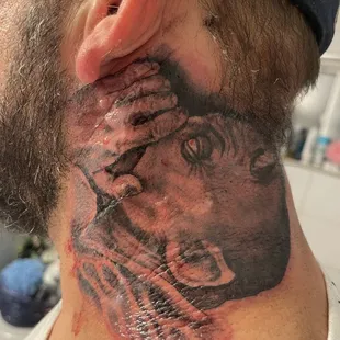 Tattoo of devil whispering in ear