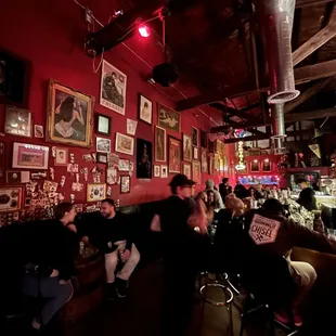 a group of people sitting at a bar