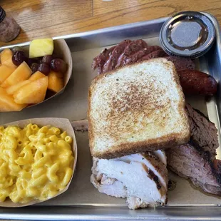 Turkey breast and sausage with Texas toast , Mac &amp; cheese and fruits
