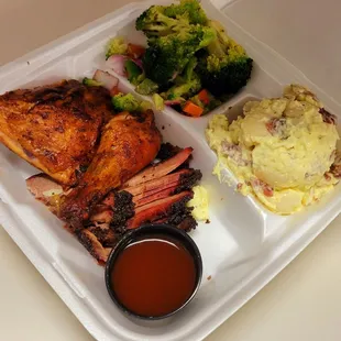 Two meat plate with chicken and brisket.