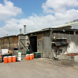 Barbecue pit smokers out back.