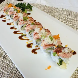 a plate of sushi rolls on a table