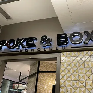 the entrance to poke and box