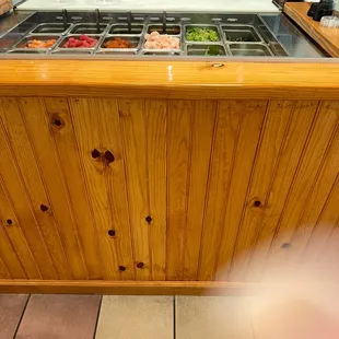 a wooden counter with a variety of food items