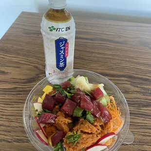 Poke bowl make your own tuna with spicy tuna!!!!! And unsweet jasmine green tea! Yummy...