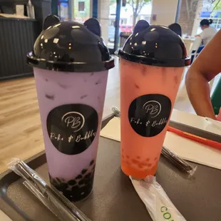 Tarot bubble tea with boba and strawberry bubble tea with popping bubbles.