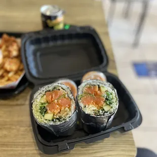 three sushi rolls on a table