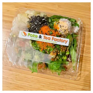 a salad in a plastic container