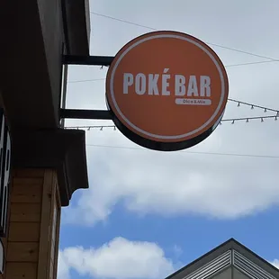 a sign for a poke bar