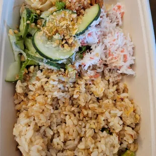 rice, cucumbers, and vegetables in a styrofoam container