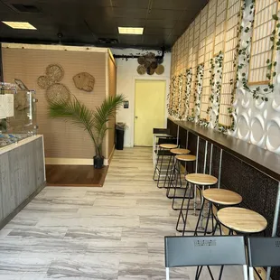 the interior of a restaurant with tables and chairs