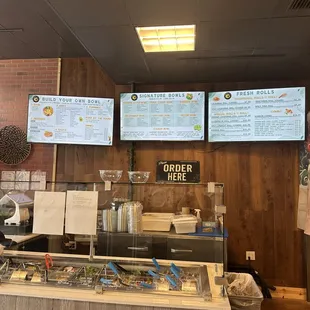 menus on the wall of the restaurant