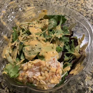 Create your own Poke bowl with spicy tuna, shrimp, and imitation crab meat.