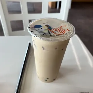 a cup of iced coffee on a tray