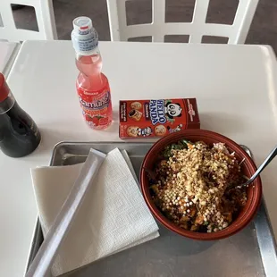 a bowl of food and a drink on a table
