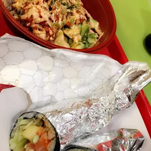 a plate of sushi and a bowl of salad