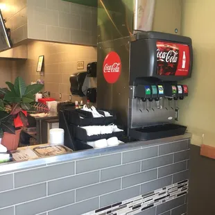 Fountain drinks, rice cake and utensil area