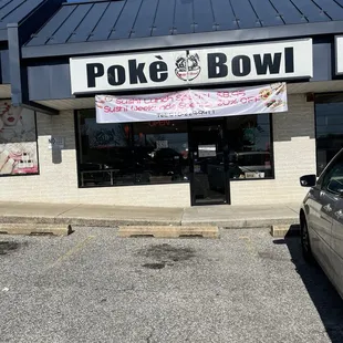 a car parked in front of a poke bowl