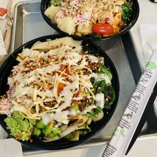 Large poke bowls with all the toppings and chopsticks. Lots of sauces and fresh ingredients. So filling.