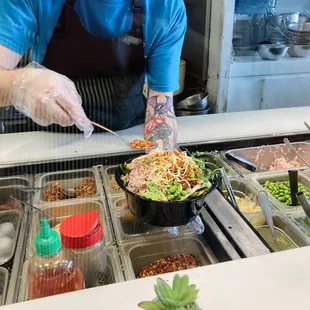 Poke bowl being made from the fresh ingredient bar.