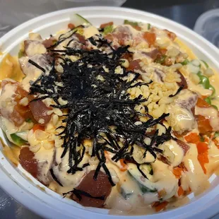 Spicy salmon with spicy Tuna poke bowl with sushi rice