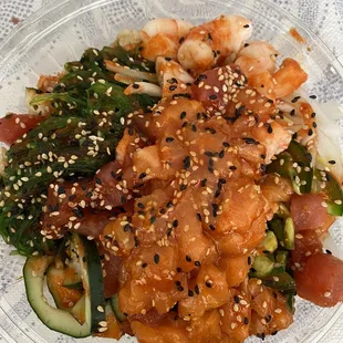 a plate of food with shrimp and vegetables