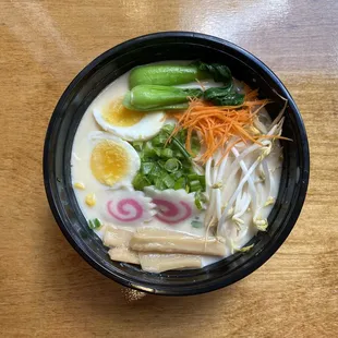 Mix Vegetables Noodle Soup. Topped with corn, scallions, greens, bamboo shoots, fish cake, and a soft boiled egg.