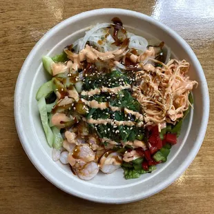 Poke Bunny Special Poké. Sushi rice, spring mix, shrimp, cucumber, bell pepper, sweet onion, crab salad, seaweed salad, sesame, eel sauce