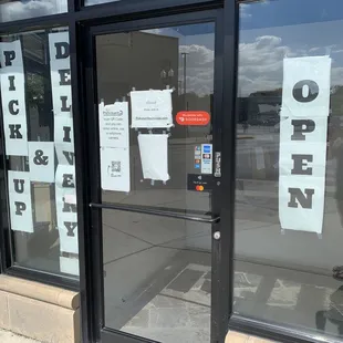 open and closed signs in a store window