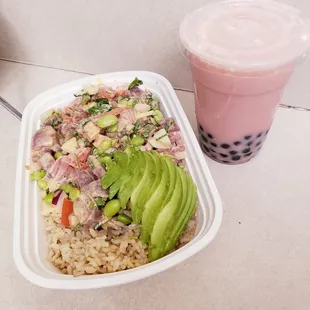Tuna poke bowl with brown rice and extra tuna. Strawberry milk boba. Yum! Best in the city!