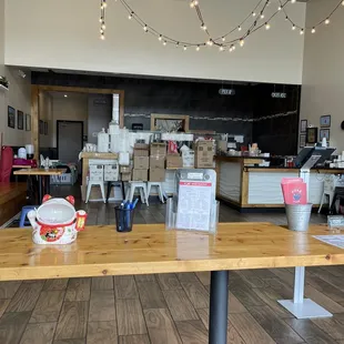 a wooden table and chairs in a restaurant