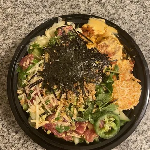 Small Build Your Own with salad, rice, tuna, spicy tuna, krab, jalapeño, edamame, daikon, cucumber, cilantro, spicy mayo, Thai chili &amp; nori