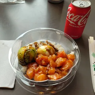 Poke bowl with a coke can and chopsticks