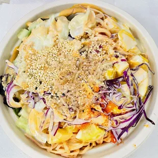 Poke Bowl with kani, veggies with mixed spring greens