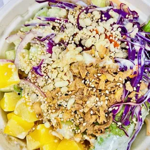 kani, rice/spring mix, red cabbage, asparagus, daikon, red&amp;green onions, avocado, cucumber topped w/crunchies &amp; Yuzu Wasabi sauce