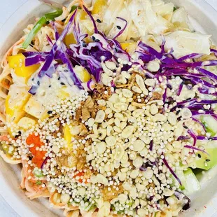This poke bowl had rice, salad, pineapple, mango, kani, cabbage, avocado &amp; all the crunchies