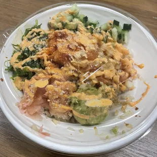 salmon bowl with brown rice cucumber, and fire roasted corn and avocado