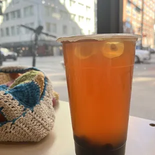 a glass of iced tea on a table